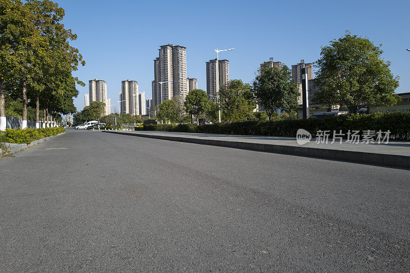 city ​​buildings beside asphalt road